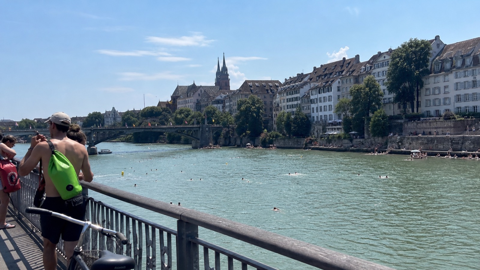 August swimmers in the Rhine below Basel's old town