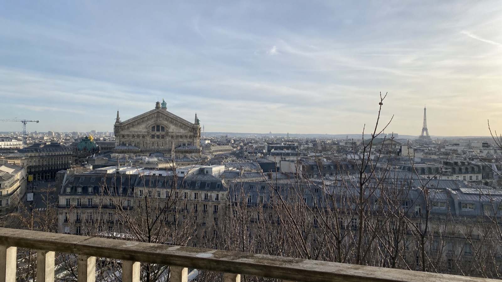 The Palais Garnier and Eiffel Tower from a winter Paris rooftop